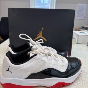 Air Jordan 11 CMFT Low Sneakers in Black, White, and Red